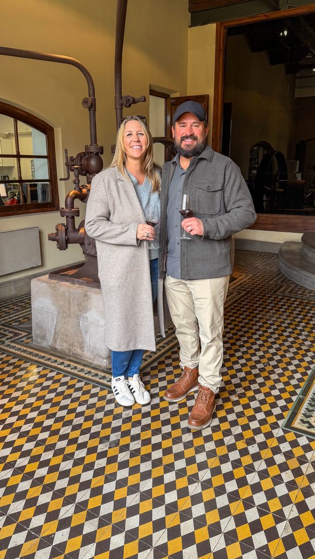 A couple on the checkerboard cellar floor