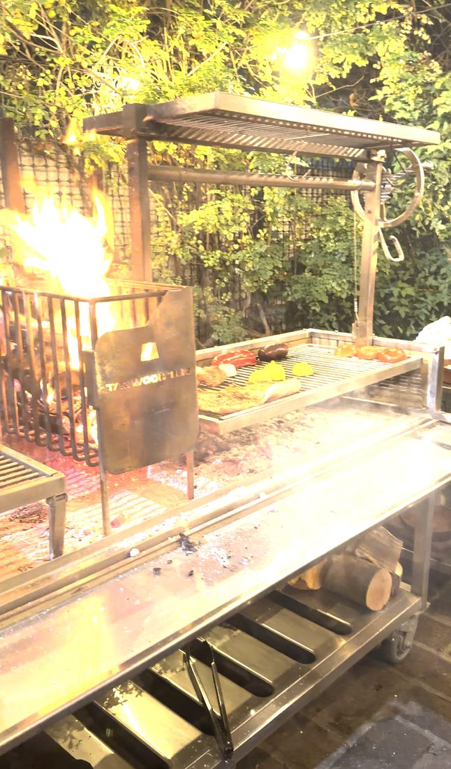 A parrilla fire at night