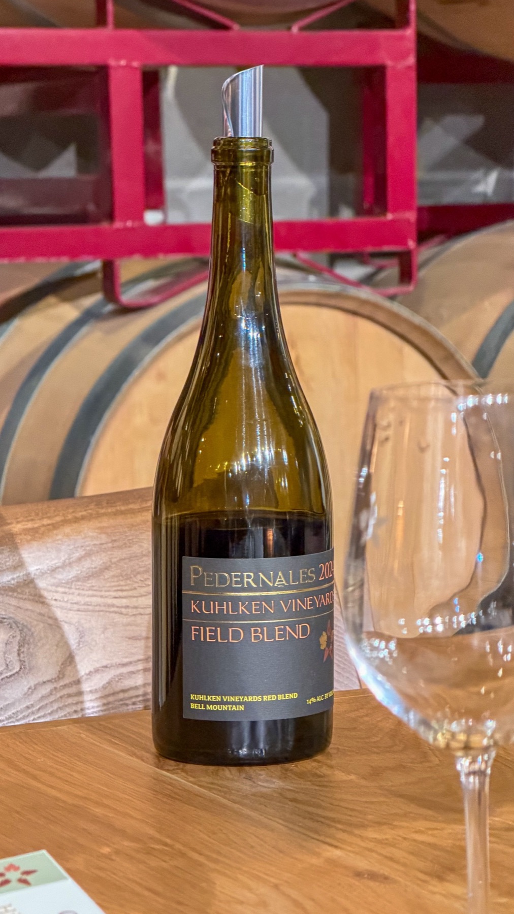 A bottle of Pedernales Kuhlken Vineyards Field Blend on the tasting table