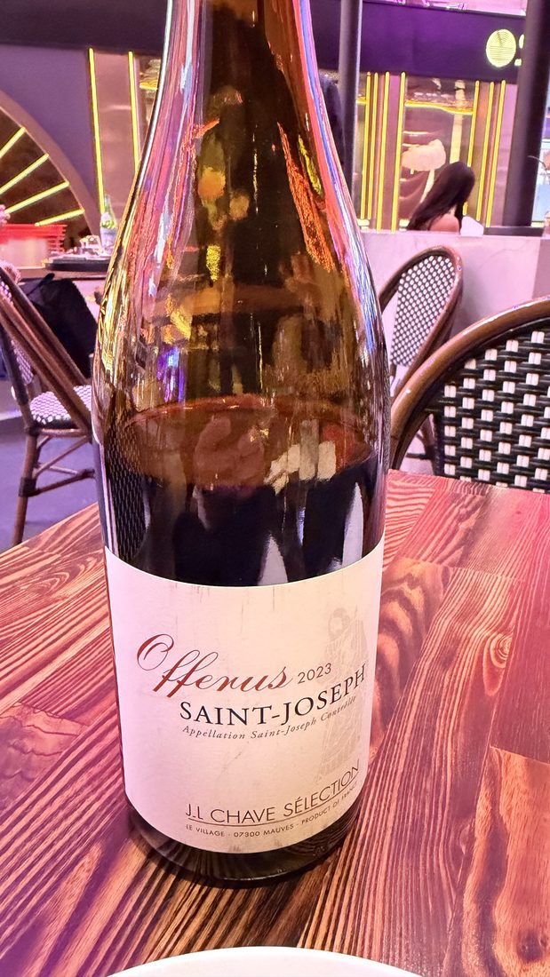 A bottle of Saint-Joseph Syrah at the table