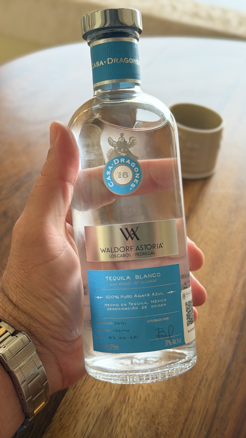 A numbered bottle of Casa Dragones tequila in the room